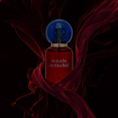 aranda de orchid perfume bottle and flowing red fabric