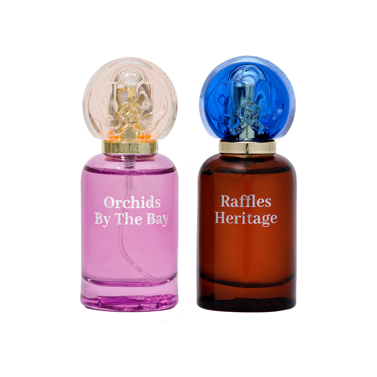 Two perfume bottles labeled 'Orchids By The Bay' and 'Raffles Heritage' on a white background.