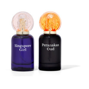 two perfume bottle, one singapore girl and one peranakan oud unisex scent.
