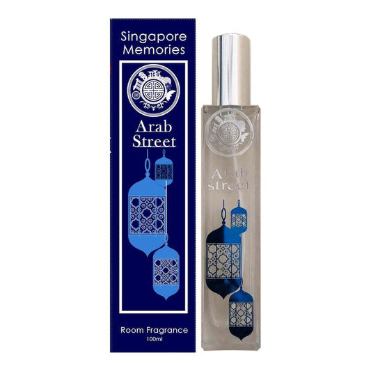 Arab street scent bottle with arabic lamp design, next to a blue gift box, on white background