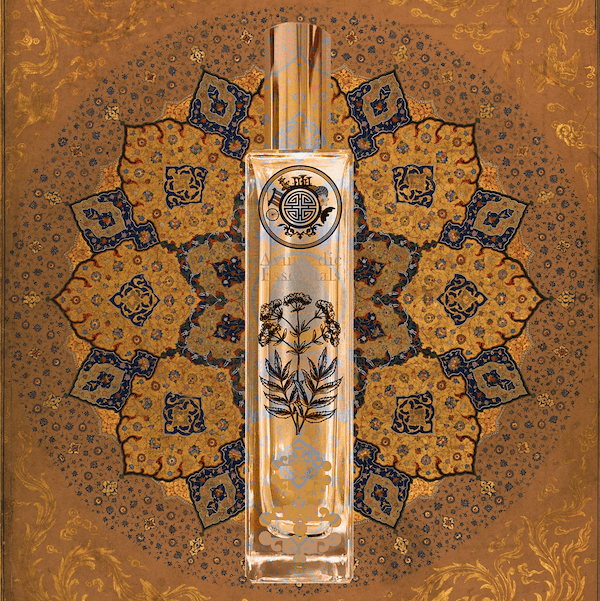 Perfume bottle with ayurvedic essential text and decorative design on a batik patterned background