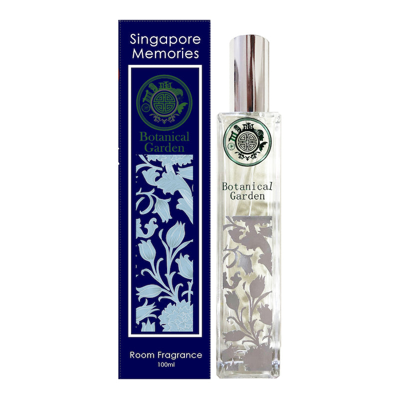 botanical garden room fragrance by singapore memories shows silver floral motif next to a blue coloe gift box in white background