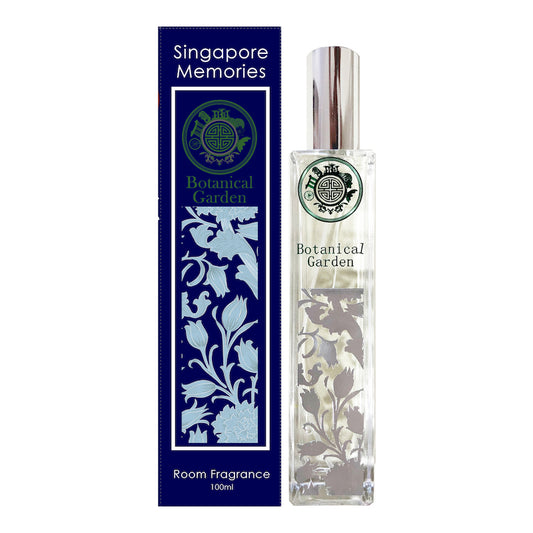 botanical garden room fragrance by singapore memories shows silver floral motif next to a blue coloe gift box in white background