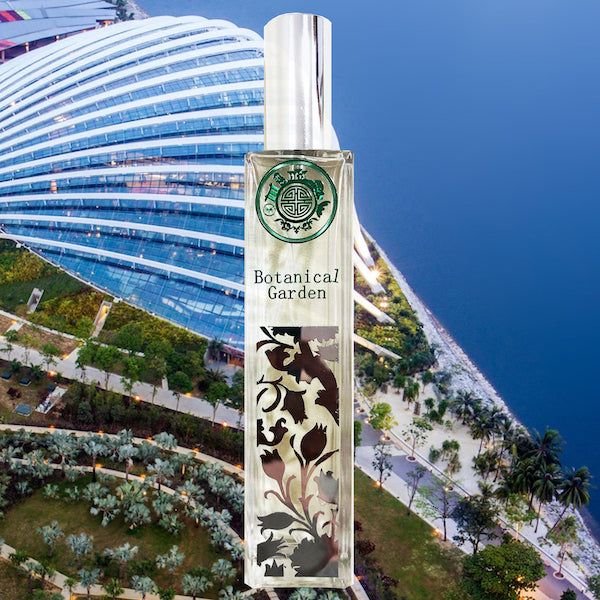 perfume bottle with botanical garden text in front of gardens by the bay and singapore sea
