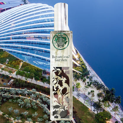 perfume bottle with botanical garden text in front of gardens by the bay and singapore sea