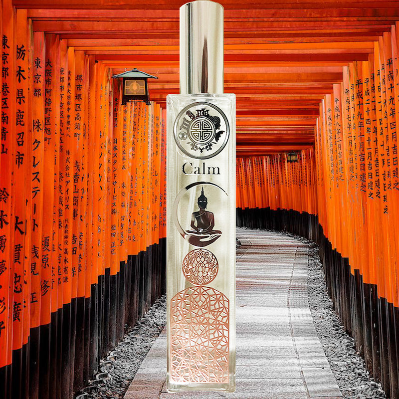 calm scent spray bottle with buddha and other icons, on background of orange Japanese gateway
