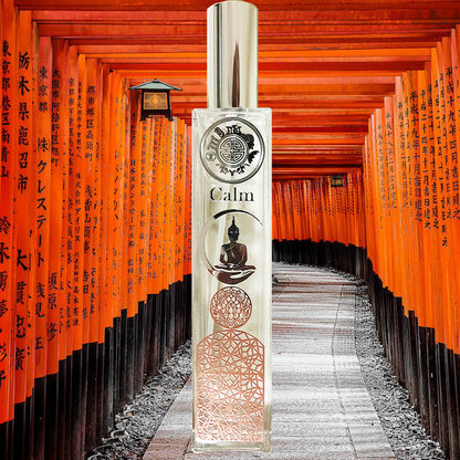 calm scent spray bottle with buddha and other icons, on background of orange Japanese gateway