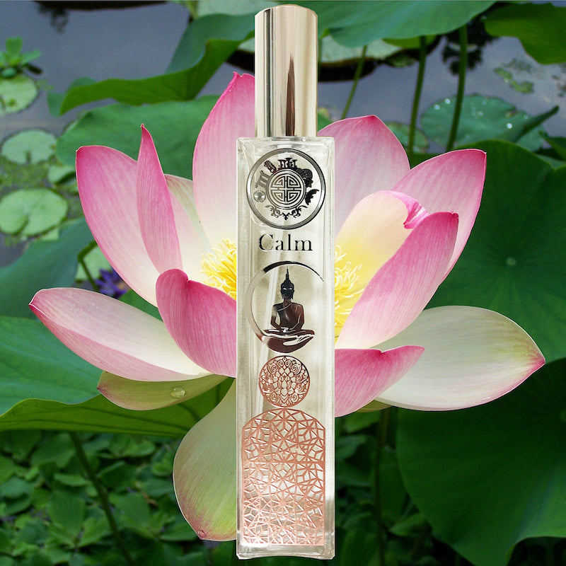 calm scent bottle with buddha symbol on background of lotus and greenry