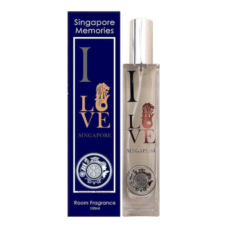 i love sg scent in a glass bottle with merlion, next to a blue gift box with similar theme on white background