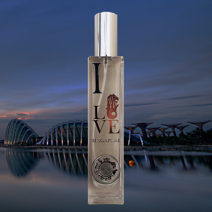 I love SG scent glass bottle in front of singapore skyline with elegant building of gardens by the bay
