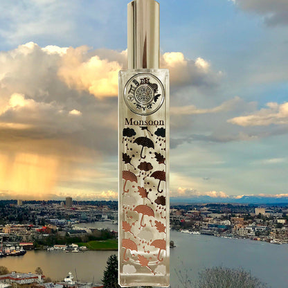 Monsoon perfume bottle in front of singapore cityscape and water