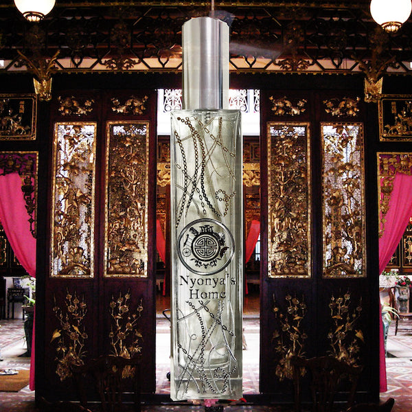 Nyonya's home room fragrance in front os a lady's peranakan furniture 