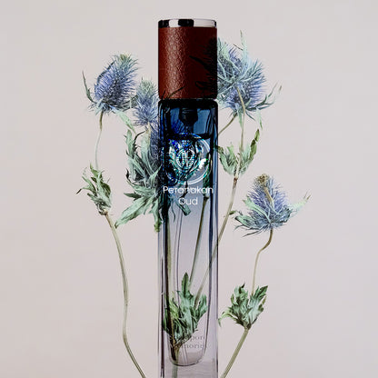 blue bottle with blue flower on white background showing Singapore Online Perfume Collection by Singapore Memories