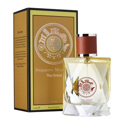 one yellow crystal perfume bottle with orchid scent called the orient in front of a box that says singapore memories perfume