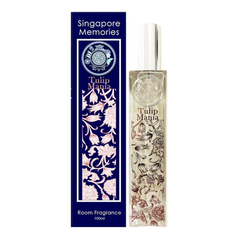 Tulip Mania room fragrances in glass bottle next to blue gift box with same designs and white background