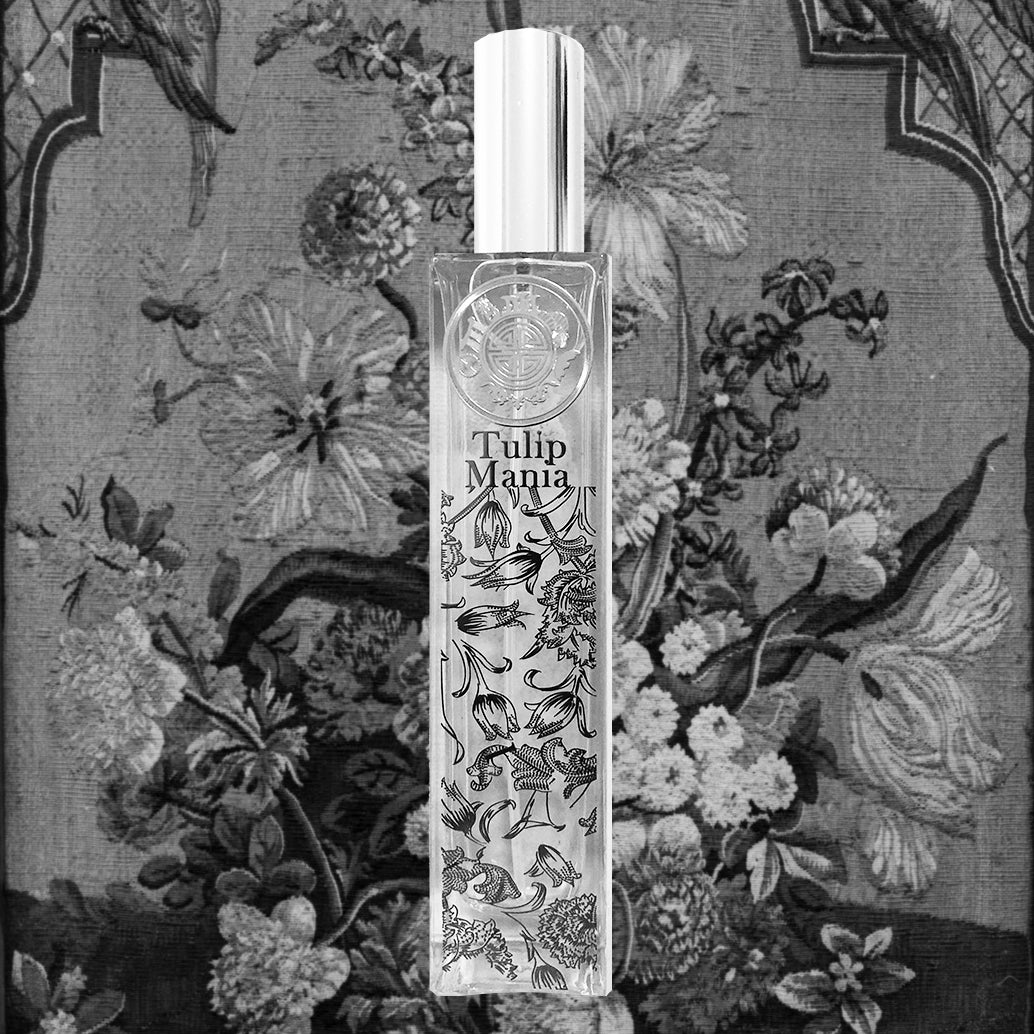 Tulip Mania room fragrance black and white in front of floral painting