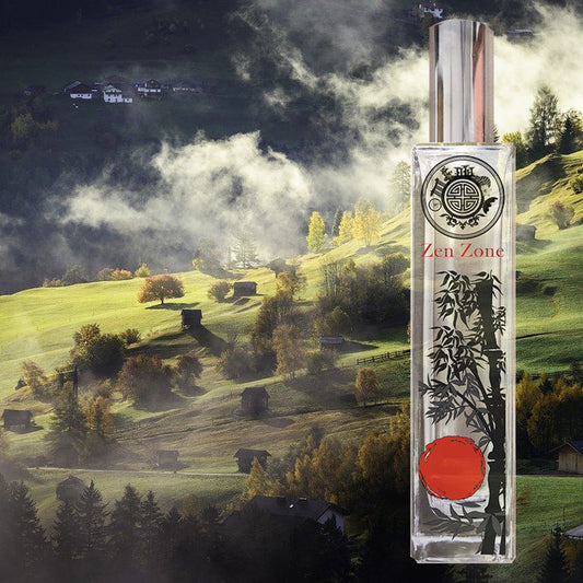 Bottle of zen zone with bamboo and sun symbol in front of a mountain and green background