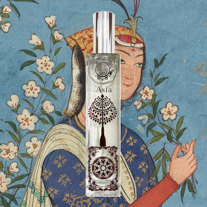Asia perfume bottle in front of a fine mughal painting with lady holding flower 