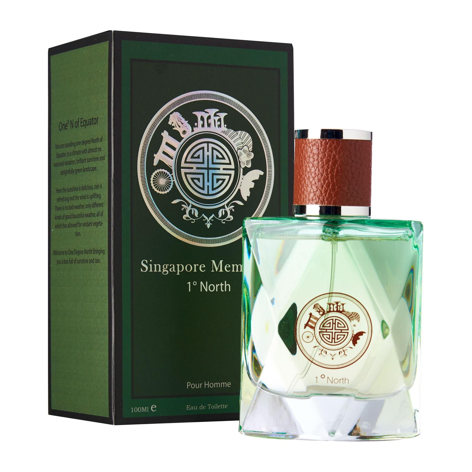 Singapore Orchid Perfume Collections- Singapore Memories , One Degree North gift box with singapore memories text behind. The circle logo contains merlion, gardens by the bay, singapore flyer in a circle