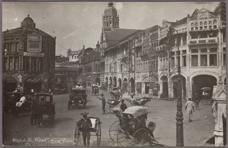 an old picture of singapore with rikshaw and european looking buildings