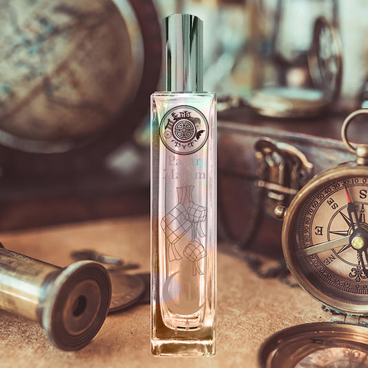 Pasar malam perfume glass bottle on top of an antique corporate table with watch, globe and other items