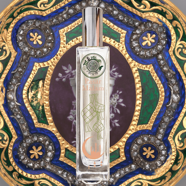 Pasar malam room fragrance in front of an embellished art jewel in blue, green and gold color