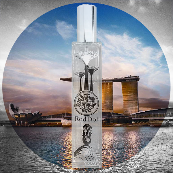 red dot perfume bottle with background of singapore sea and beautiful building
