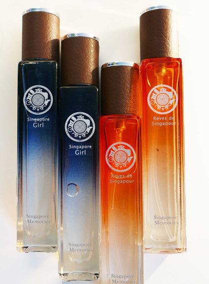travel size Perfume collection Reves De Singapour,  and singapore girl by singapore memories in blue and orange bottle with leather cap