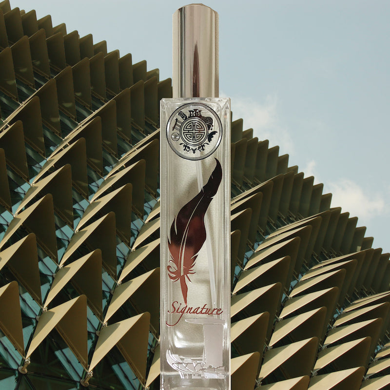 Signature singapore room fragrance in front of esplanade building with spike front facade
