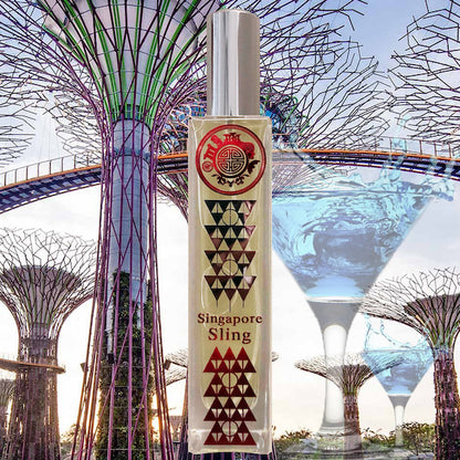 singapore sling room fragrance bottle with gardens by the bay in background and overlapping wine glasses with blue liquid in them