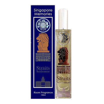 straits settlement room fragrance in beautiful crystal bottle with lion and other stately symbols next to a blue gift box with similar elegant embellishment