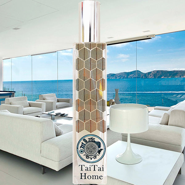 A tall, cylindrical fragrance diffuser with a geometric pattern in beige and white, featuring the brand name 'Tai Tai's House' at the bottom.